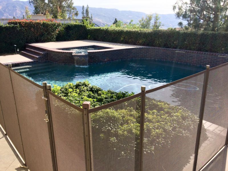Mesh Fence Installed Along Pool Edge